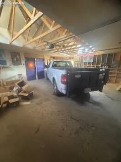 a view of a livingroom with wooden floor and a ceiling fan