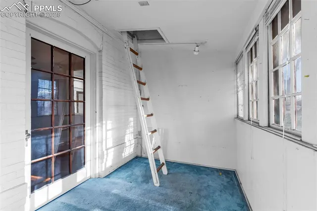 an empty room with windows