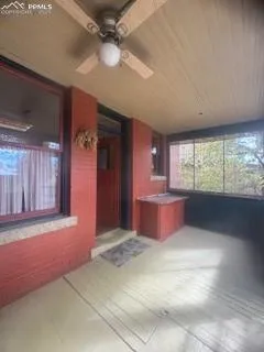 a kitchen with granite countertop a sink stove and cabinets