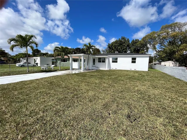 a view of swimming pool with a yard