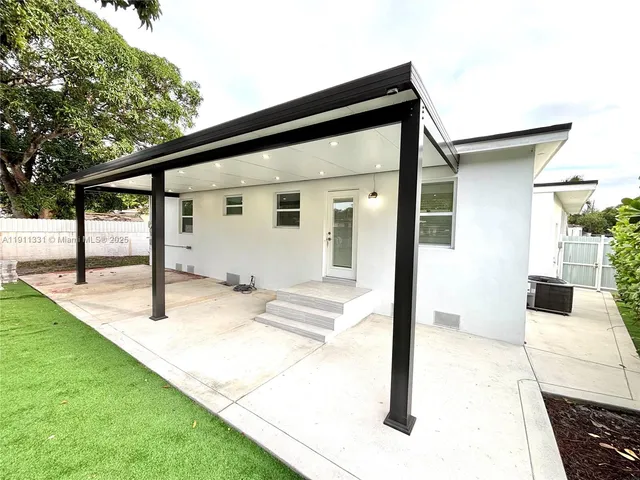 a view of a patio with a backyard