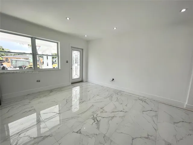 a kitchen with stainless steel appliances a refrigerator and a stove top oven