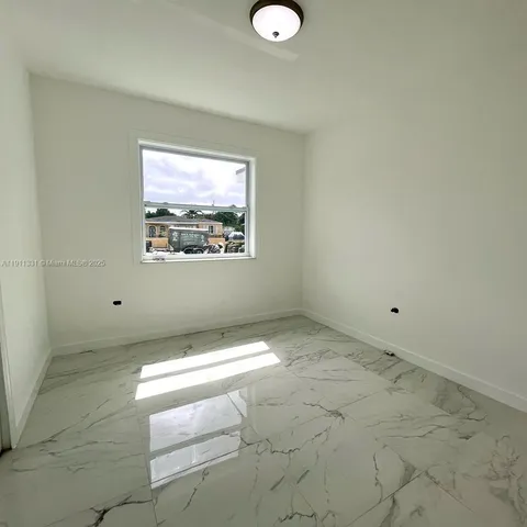 a bathroom with a toilet a sink and a mirror