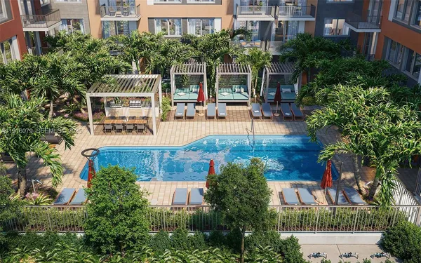 an aerial view of a house with swimming pool and sitting area