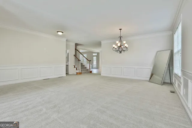 a kitchen with stainless steel appliances granite countertop a stove and a refrigerator