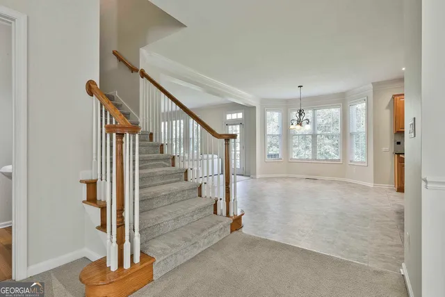 a kitchen with stainless steel appliances granite countertop a stove sink and cabinets