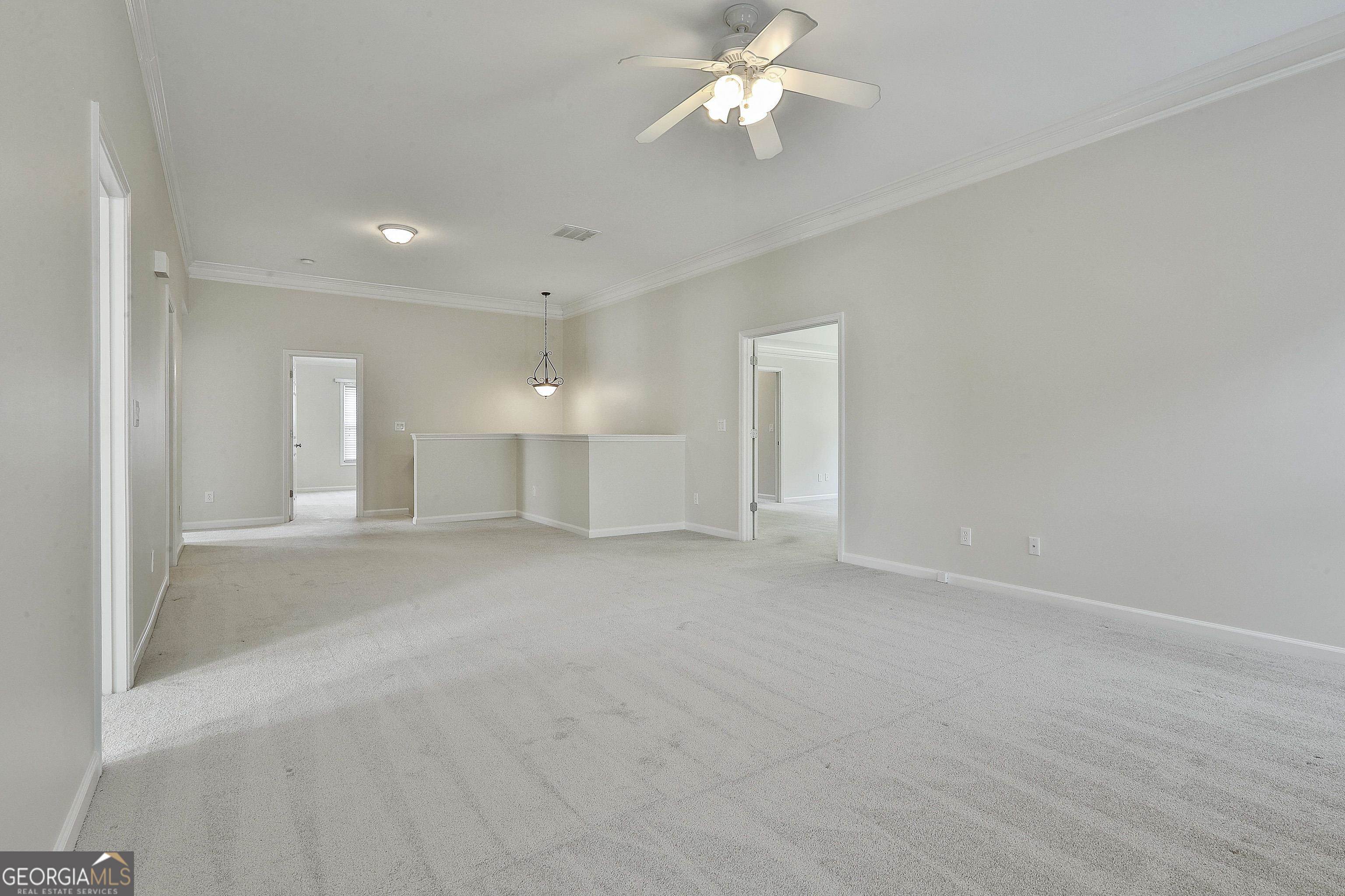 113 Westmont Way Tyrone, GA 30290 - Photo 35 of 64 a view of an empty room with a chandelier fan