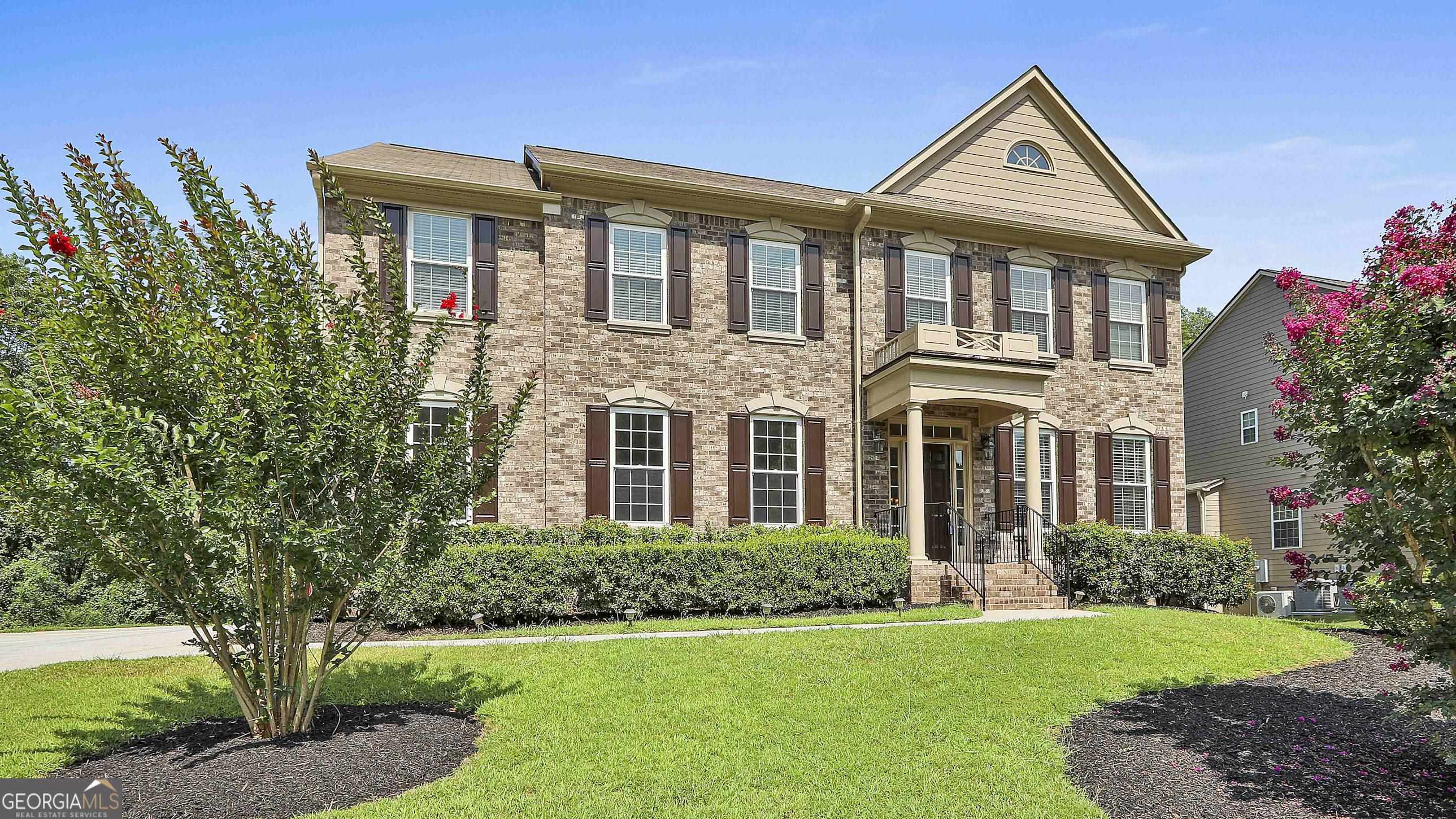 113 Westmont Way Tyrone, GA 30290 - Photo 4 of 64 a front view of a house with a yard