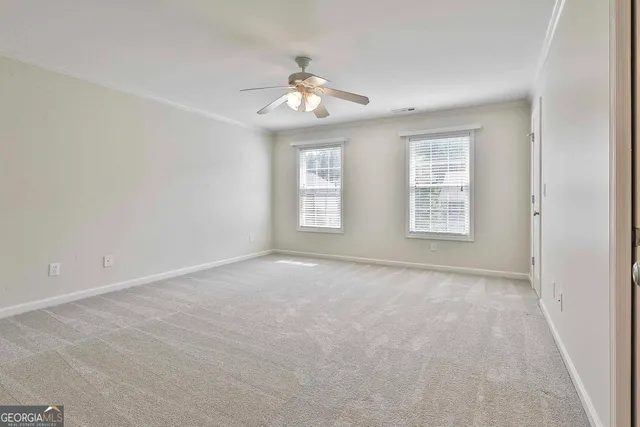 a view of a porch with furniture and garden