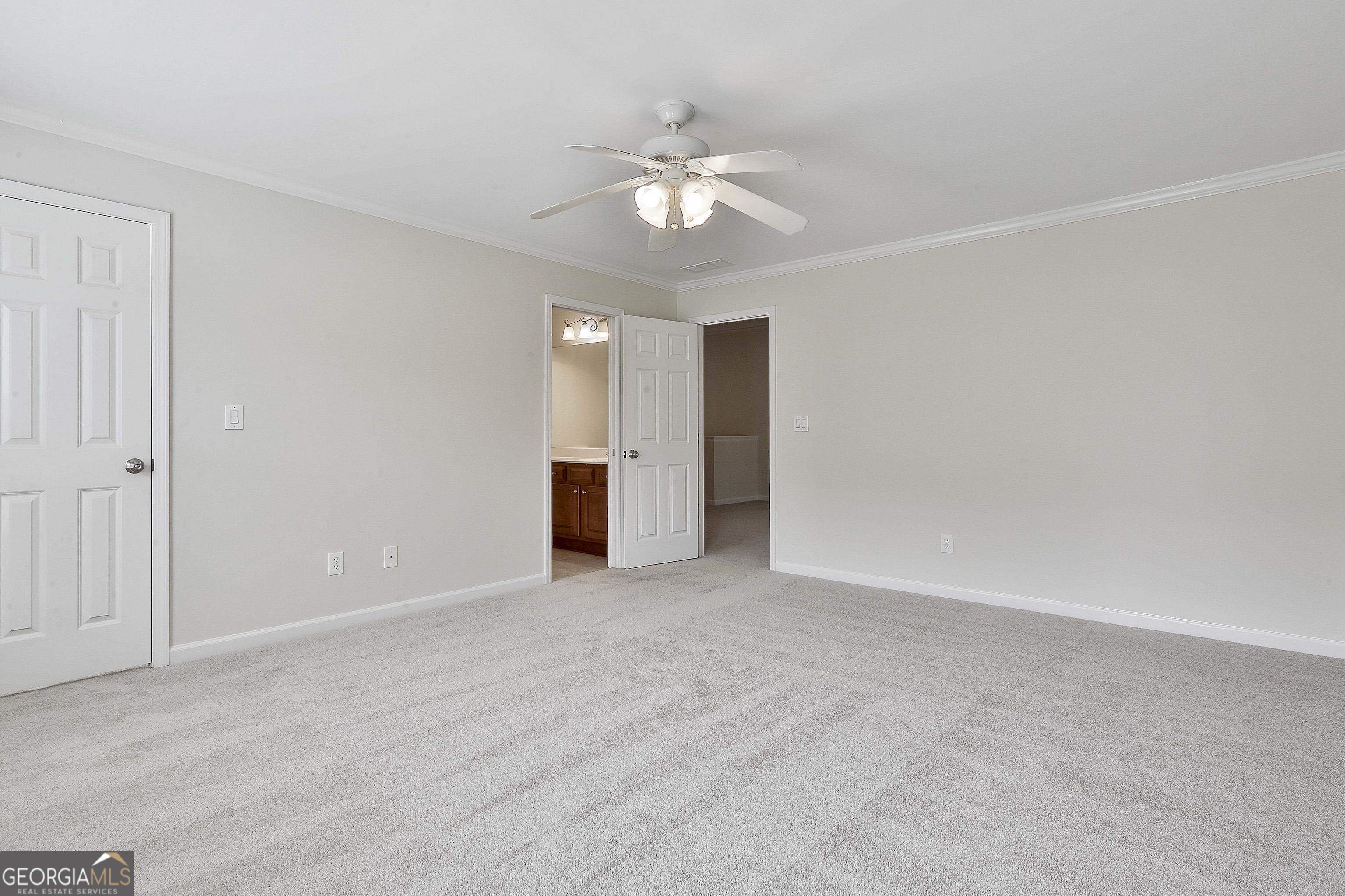 113 Westmont Way Tyrone, GA 30290 - Photo 46 of 64 a view of an empty room with a ceiling fan and window