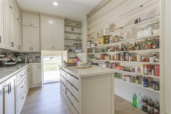 a kitchen with stainless steel appliances granite countertop a lot of counter top space and cabinets