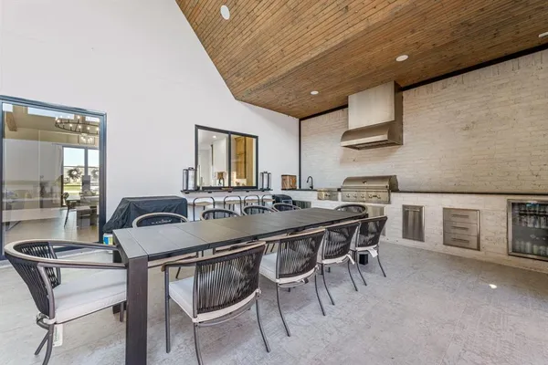 a kitchen with a table and chairs in it