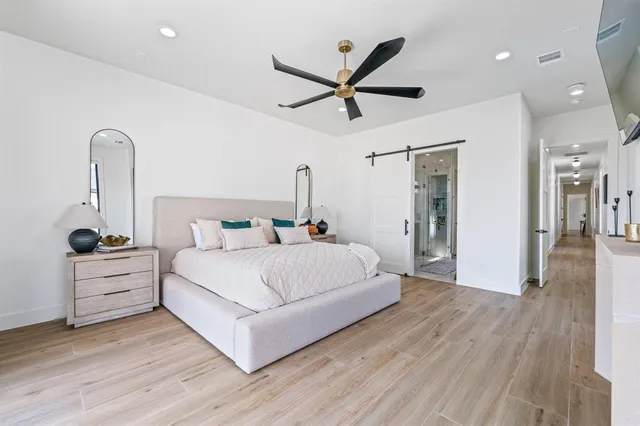 a large white bed in a white room