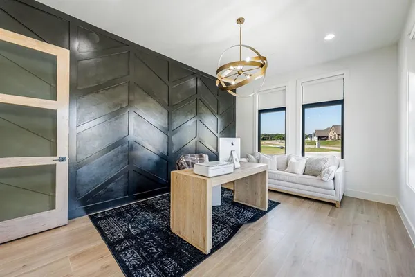 a living room with patio bathtub and a chandelier