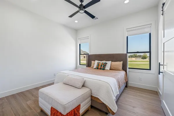 a bedroom with a bed and window