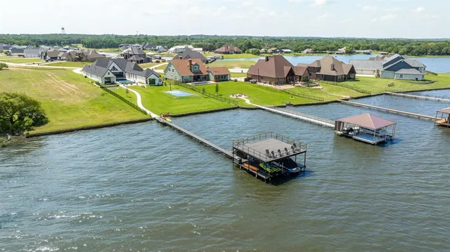 an aerial view of a houses with outdoor space