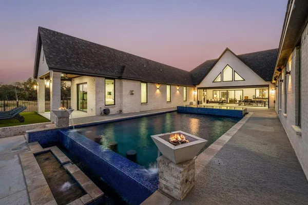 a view of swimming pool with outdoor seating