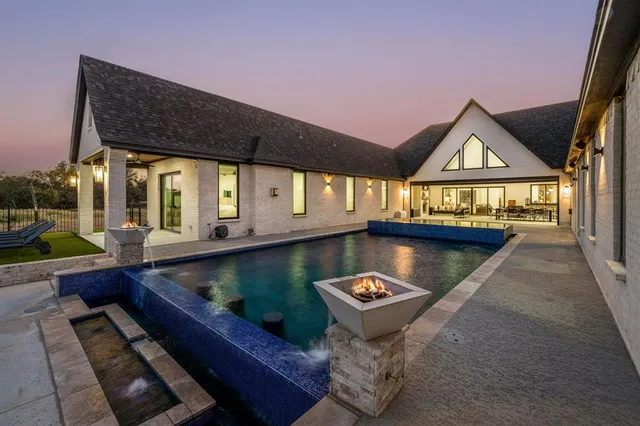 a view of swimming pool with outdoor seating