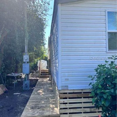 a view of a backyard with sitting area