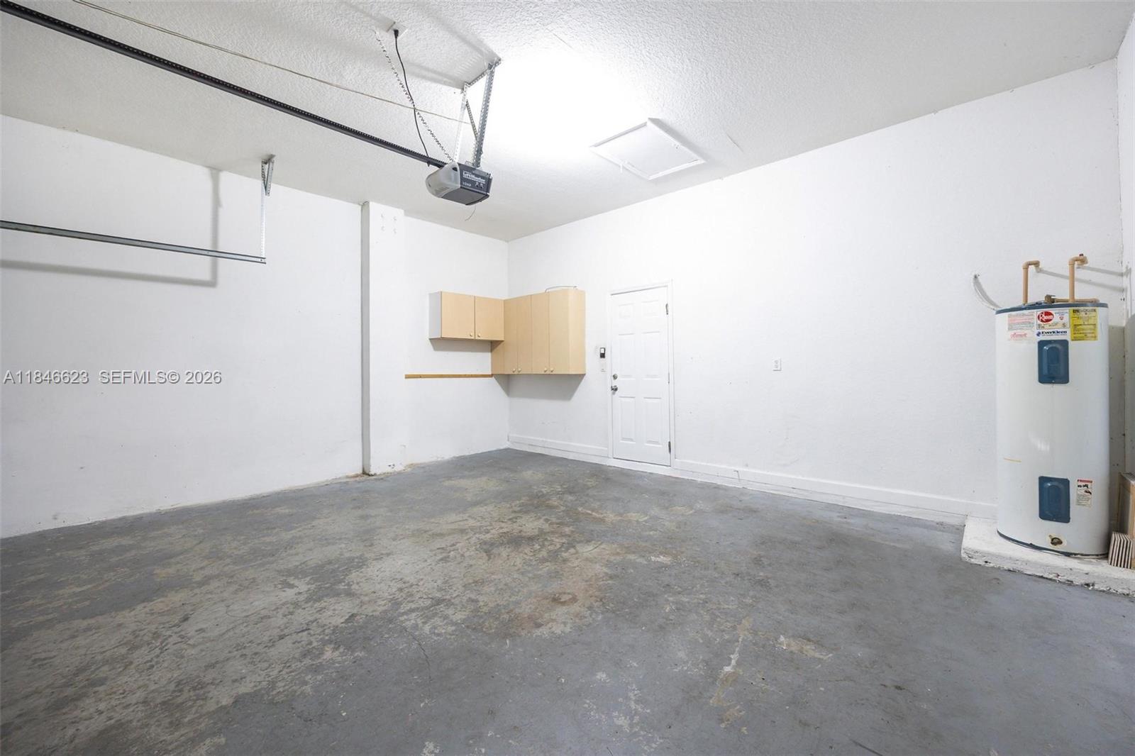 1780 Southeast 19th Terrace Homestead, FL 33035 - Photo 15 of 70 a view of a storage & utility room with refrigerator and window