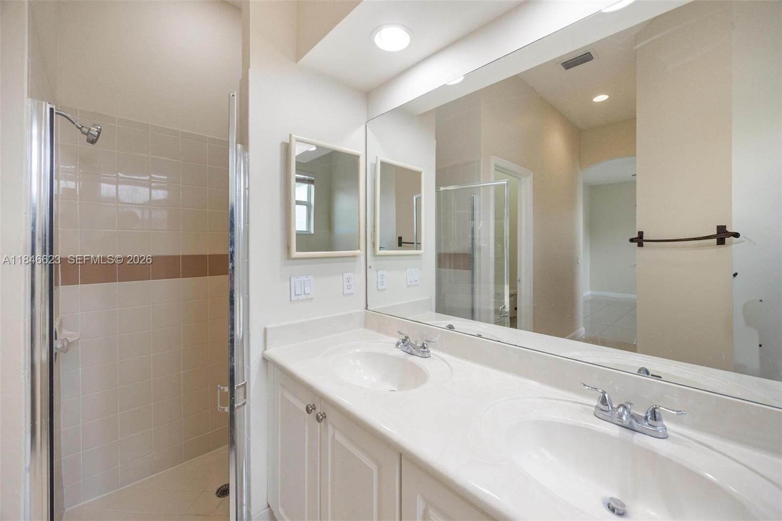 1780 Southeast 19th Terrace Homestead, FL 33035 - Photo 43 of 70 a bathroom with a sink and a mirror