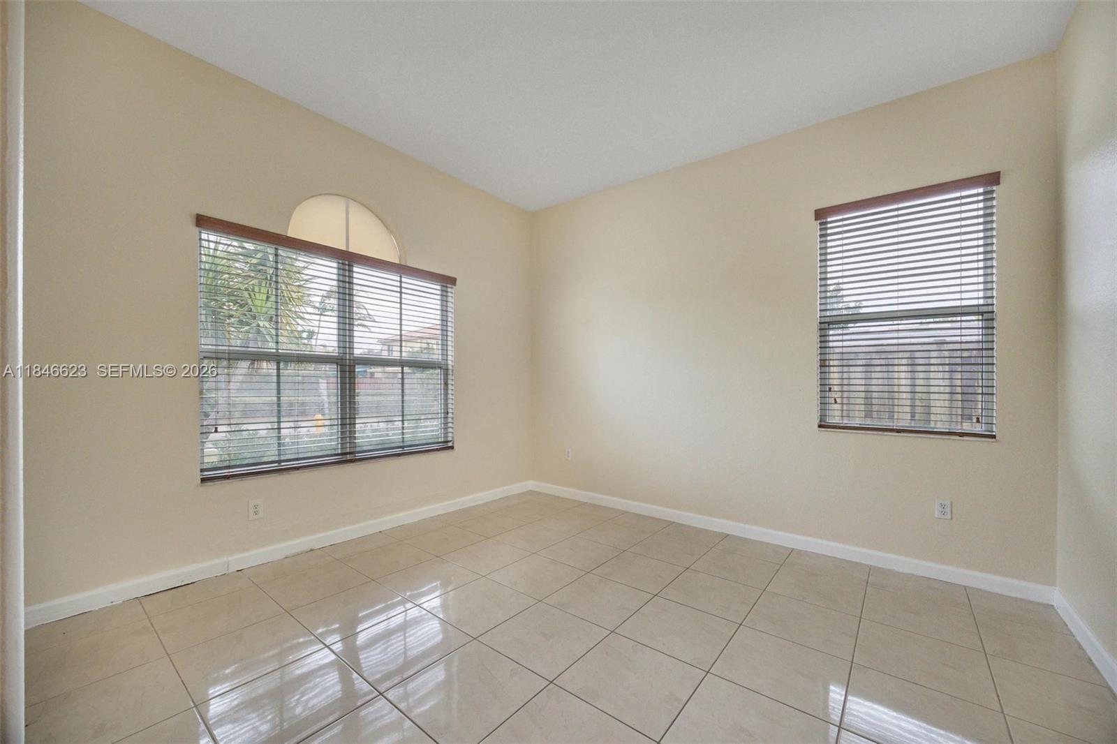 1780 Southeast 19th Terrace Homestead, FL 33035 - Photo 6 of 70 a view of an empty room with a window