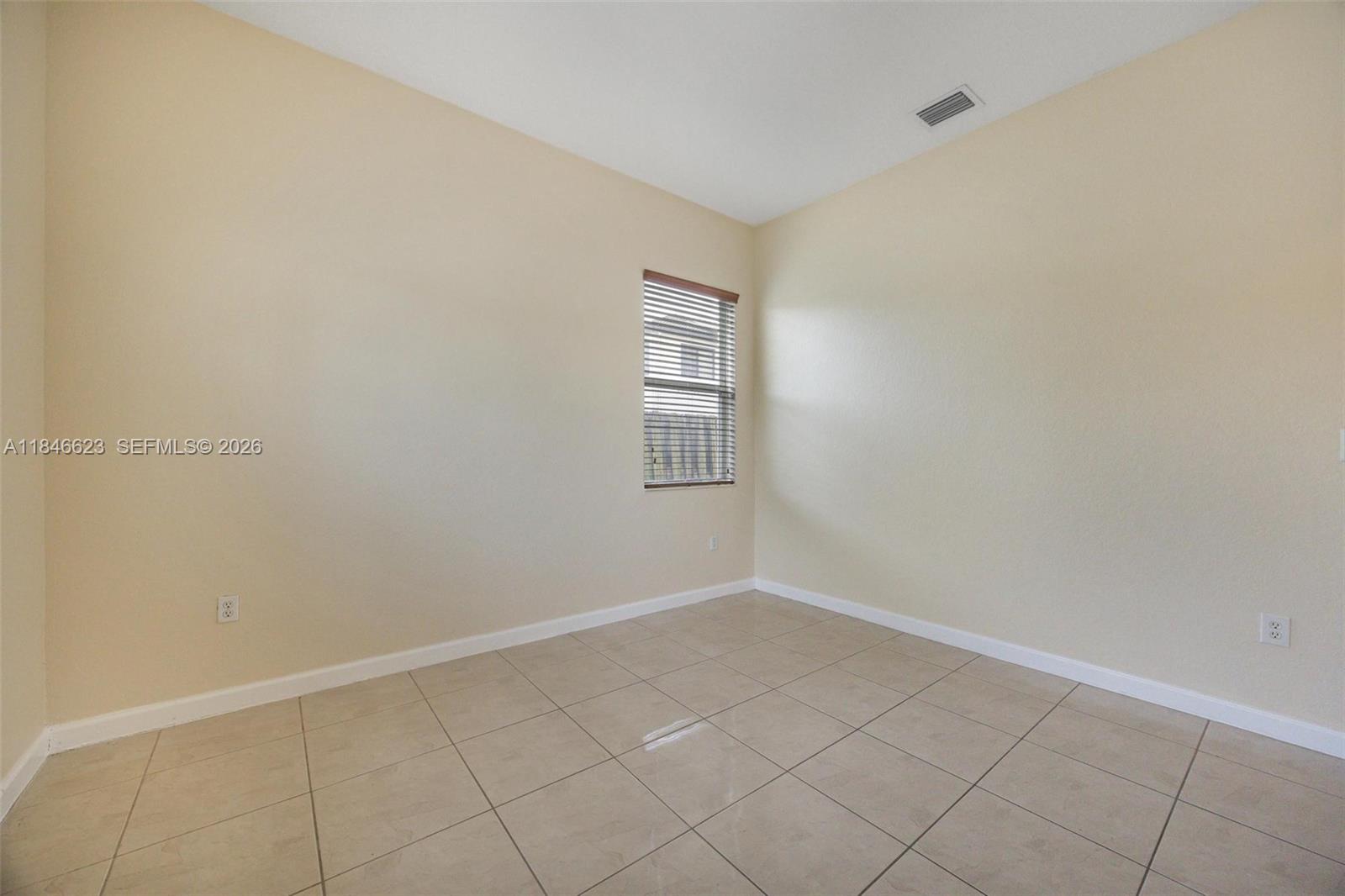 1780 Southeast 19th Terrace Homestead, FL 33035 - Photo 9 of 70 a view of an empty room and window