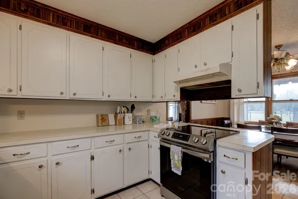 a kitchen with appliances cabinets and a sink