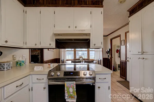 a kitchen with stainless steel appliances granite countertop a stove and a refrigerator
