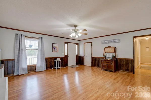 a view of a livingroom with furniture chandelier