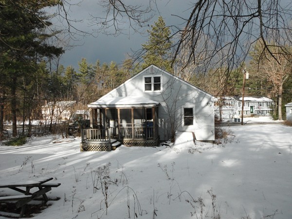 87 Lowell Road Pepperell, MA 01463 - Photo 12 of 15 a front view of a building with trees