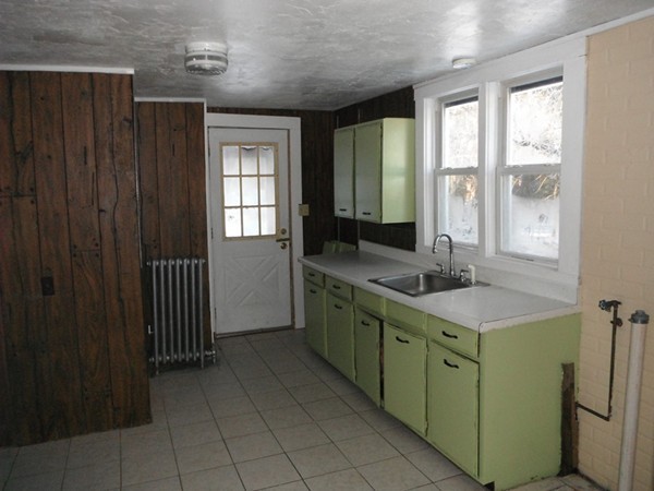 87 Lowell Road Pepperell, MA 01463 - Photo 3 of 15 a room with a window and a sink