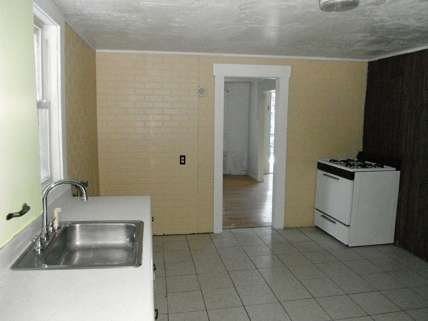 87 Lowell Road Pepperell, MA 01463 - Photo 5 of 15 a bathroom with a sink and a washing machine