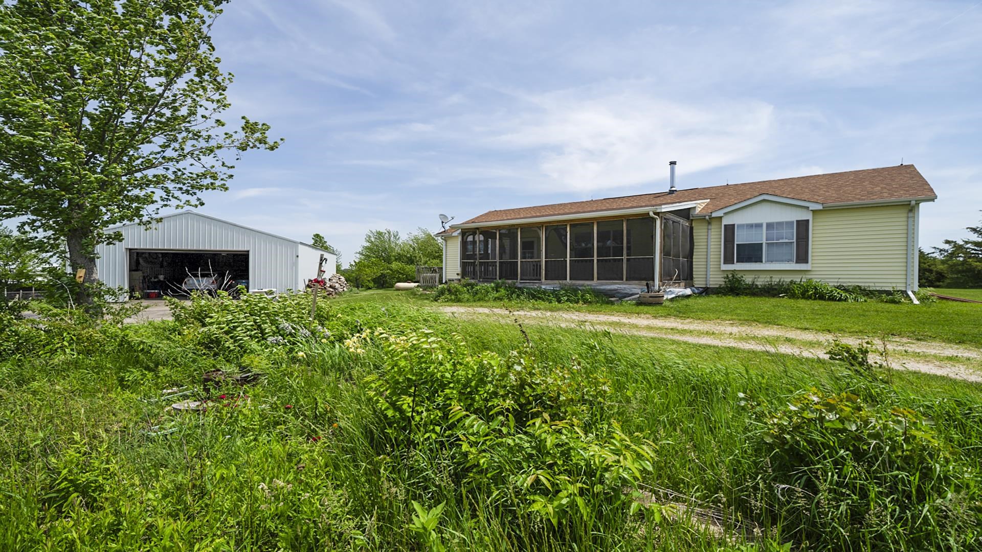 820 Brooklyn Road West Brooklyn, IL 61378 - Photo 12 of 41 a view of a house with garden and yard