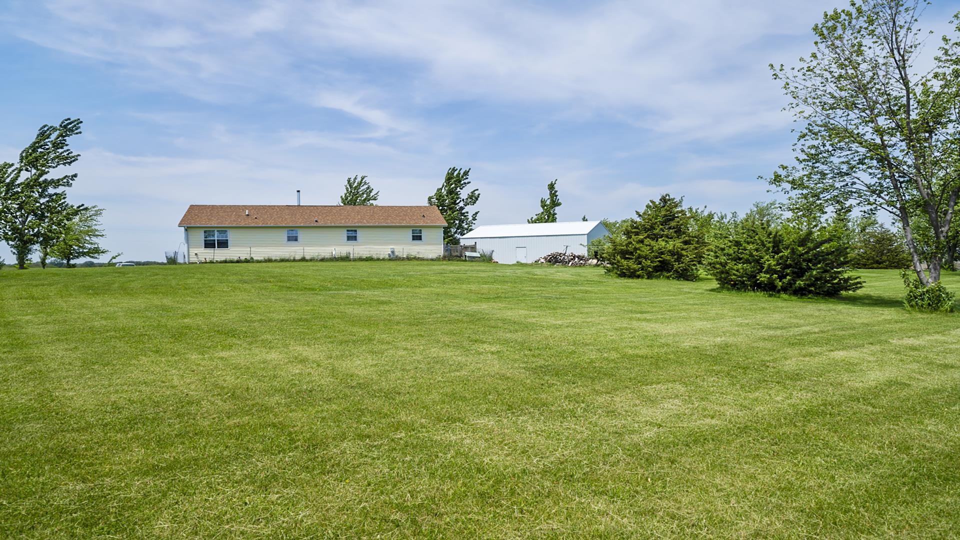 820 Brooklyn Road West Brooklyn, IL 61378 - Photo 4 of 41 a front view of a house with garden