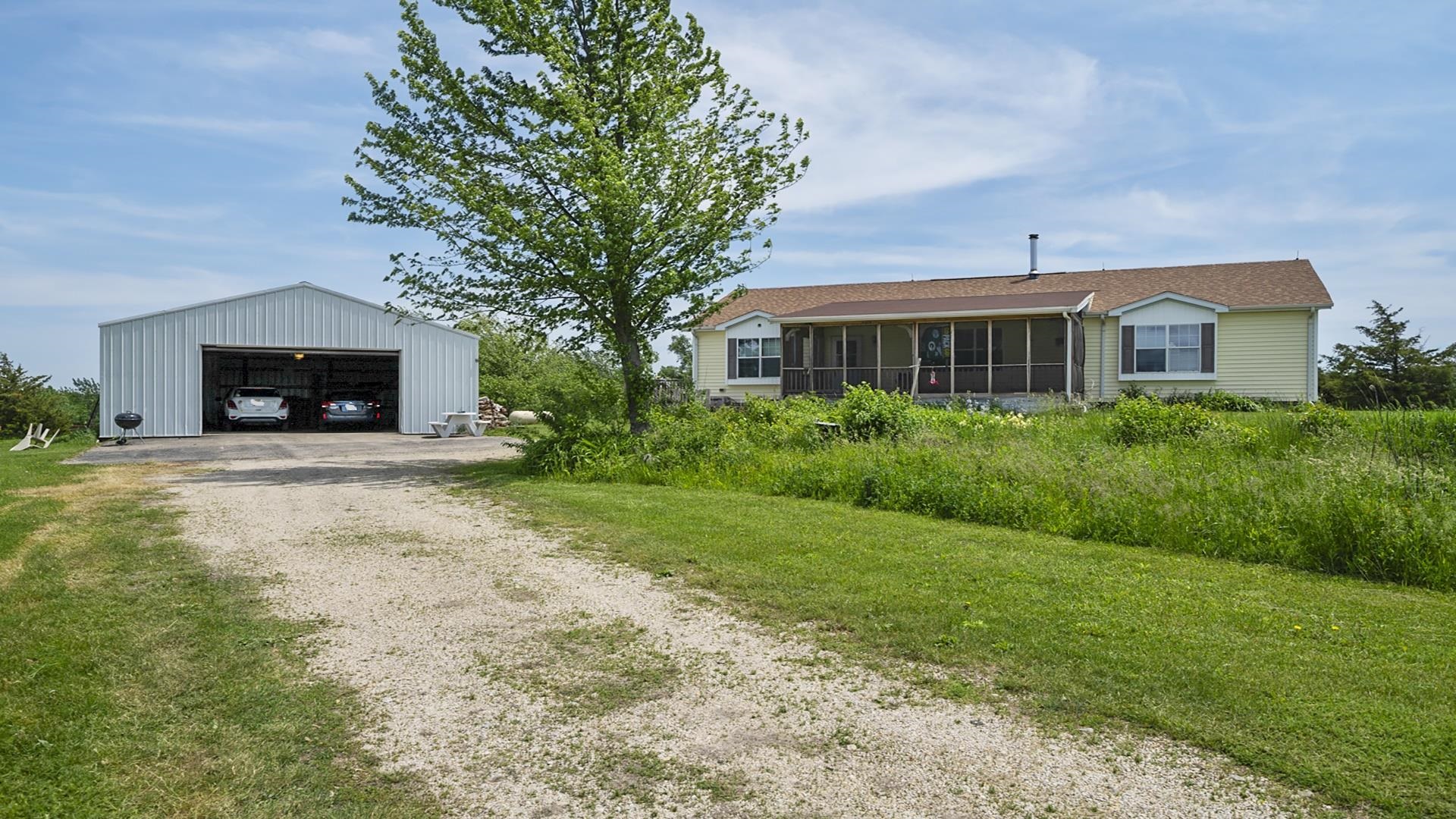 820 Brooklyn Road West Brooklyn, IL 61378 - Photo 7 of 41 a view of a house with backyard and garden