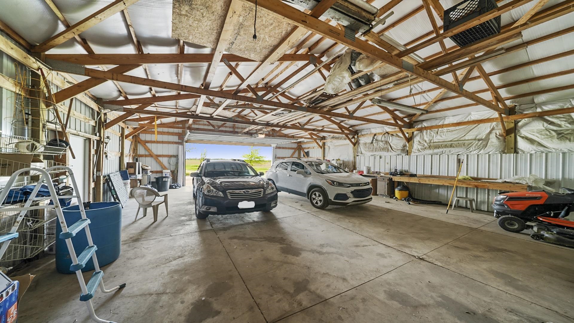 820 Brooklyn Road West Brooklyn, IL 61378 - Photo 8 of 41 a view of parking garage with cars