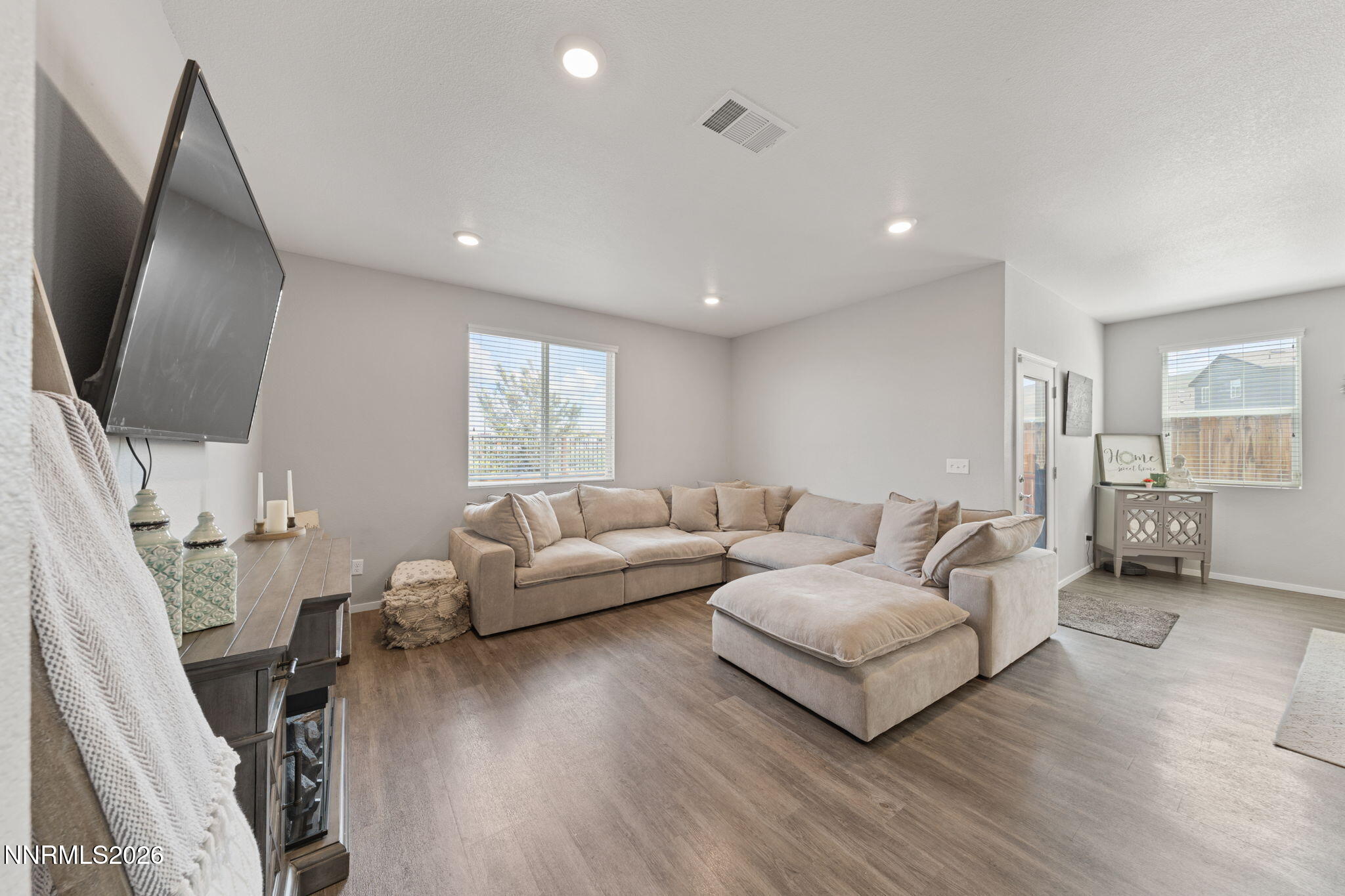 9708 Sea Glass Drive Reno, NV 89506 - Photo 24 of 51 a living room with furniture and a flat screen tv