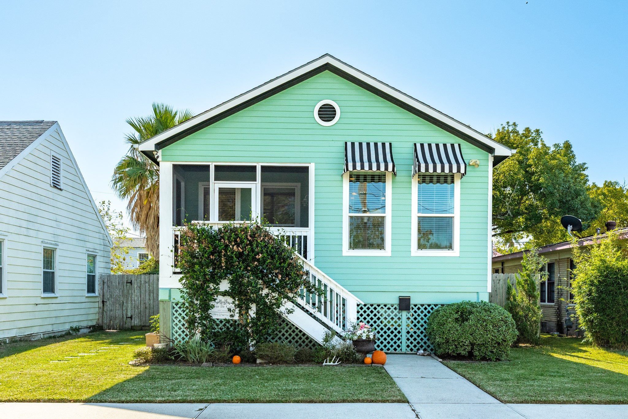 4317 Avenue R Galveston, TX 77550 - Photo 1 of 27 a front view of a house with garden