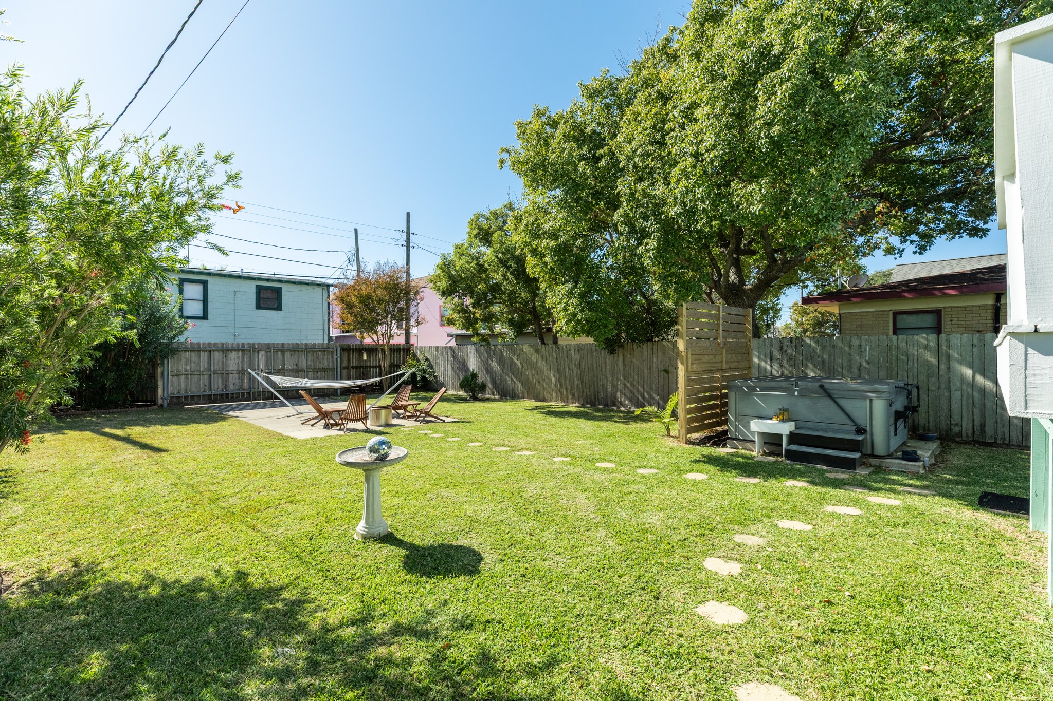 4317 Avenue R Galveston, TX 77550 - Photo 12 of 27 a backyard of a house with table and chairs