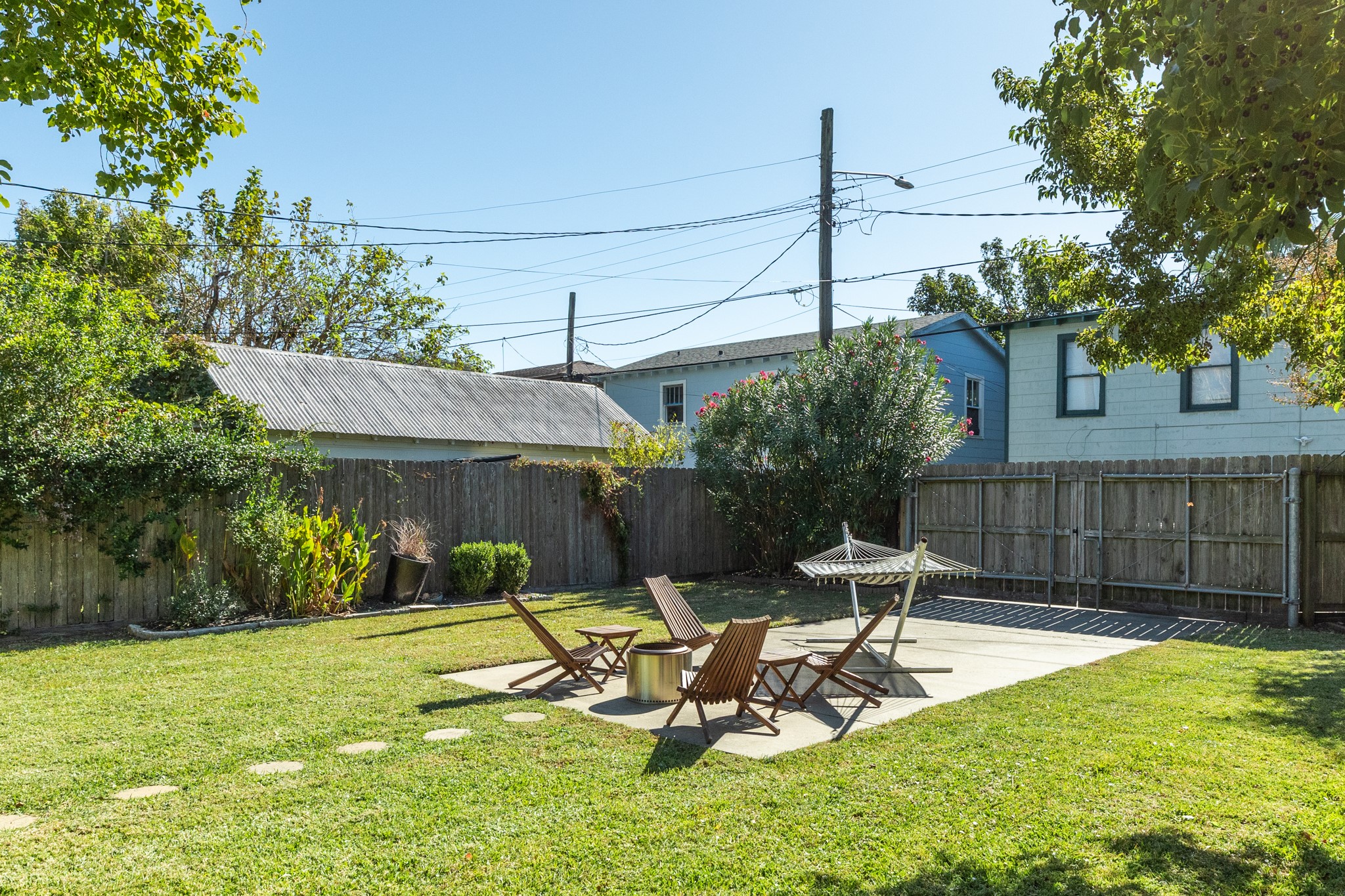 4317 Avenue R Galveston, TX 77550 - Photo 13 of 27 a view of a backyard with a table and chairs
