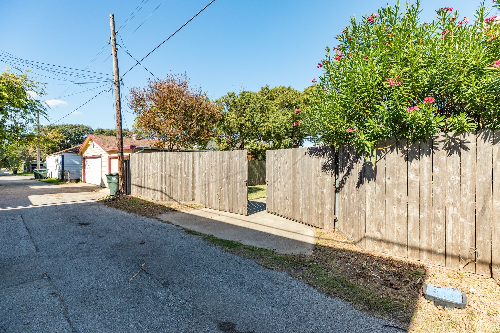 4317 Avenue R Galveston, TX 77550 - Photo 14 of 27 a view of a street with a small yard