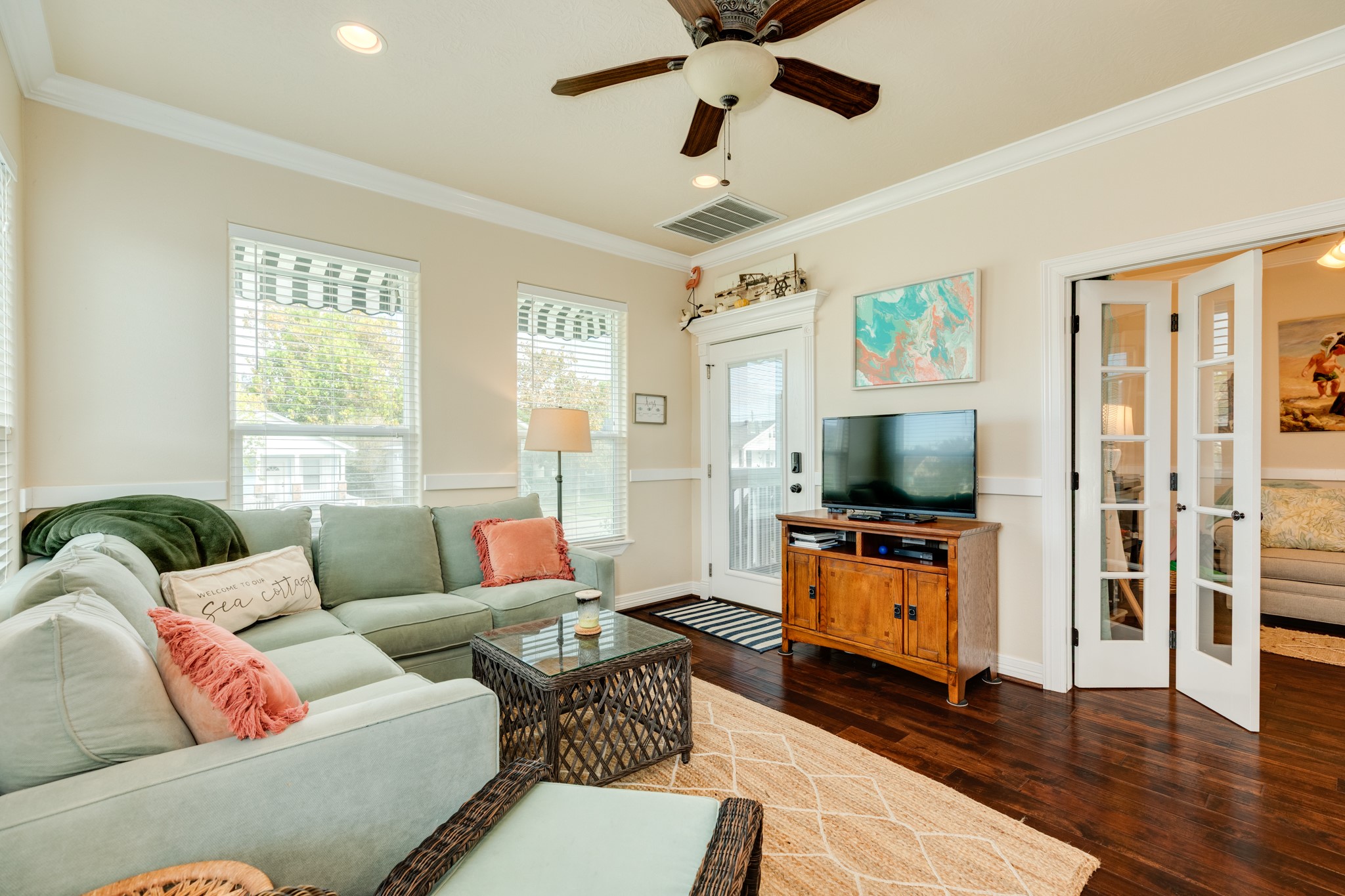 4317 Avenue R Galveston, TX 77550 - Photo 17 of 27 a living room with furniture and a flat screen tv