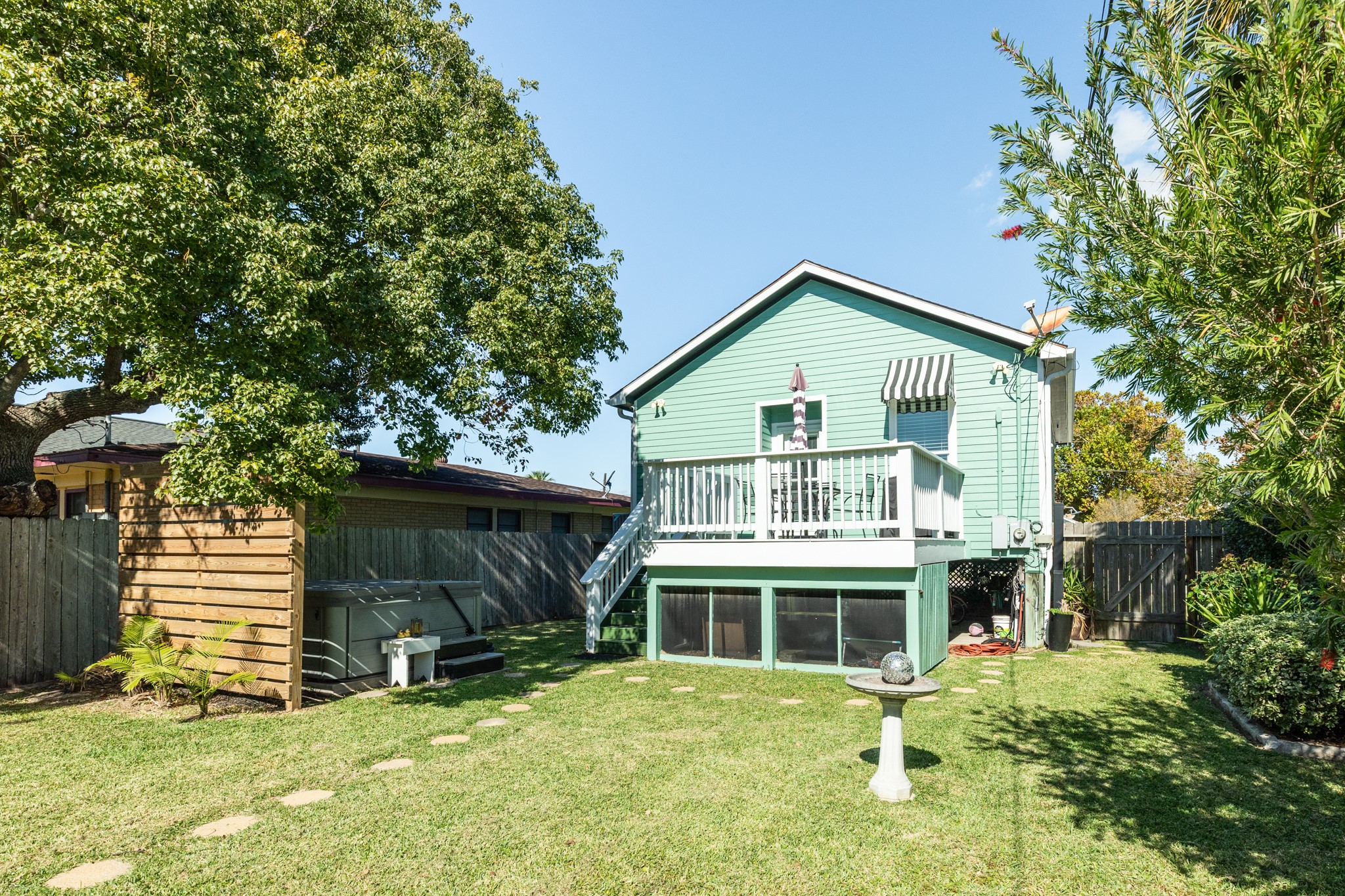 4317 Avenue R Galveston, TX 77550 - Photo 6 of 27 a front view of a house with a yard