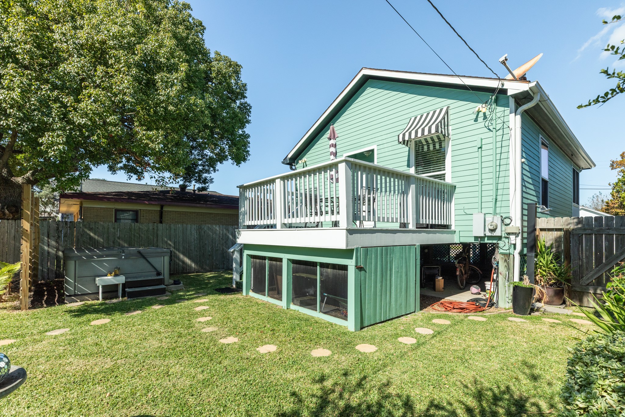4317 Avenue R Galveston, TX 77550 - Photo 7 of 27 a view of a house with a yard and sitting area