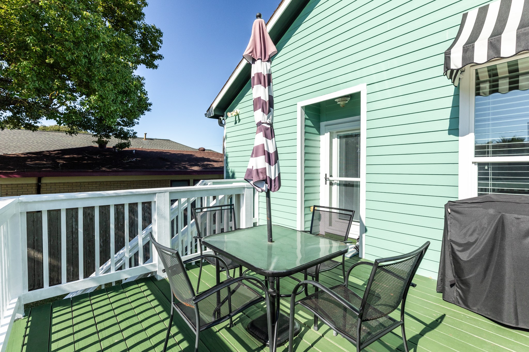 4317 Avenue R Galveston, TX 77550 - Photo 9 of 27 a view of a chairs and table in the balcony