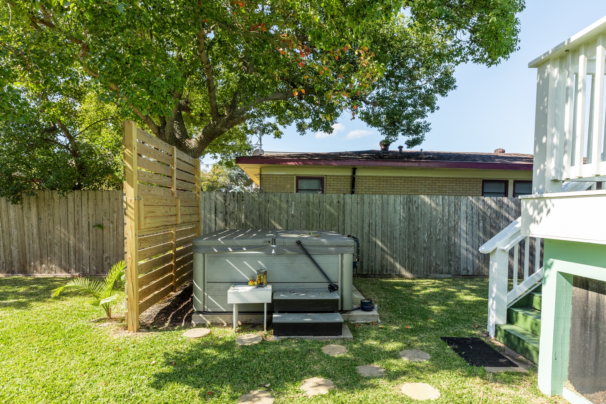 4317 Avenue R Galveston, TX 77550 - Photo 10 of 27 a view of a backyard with plants and a garden