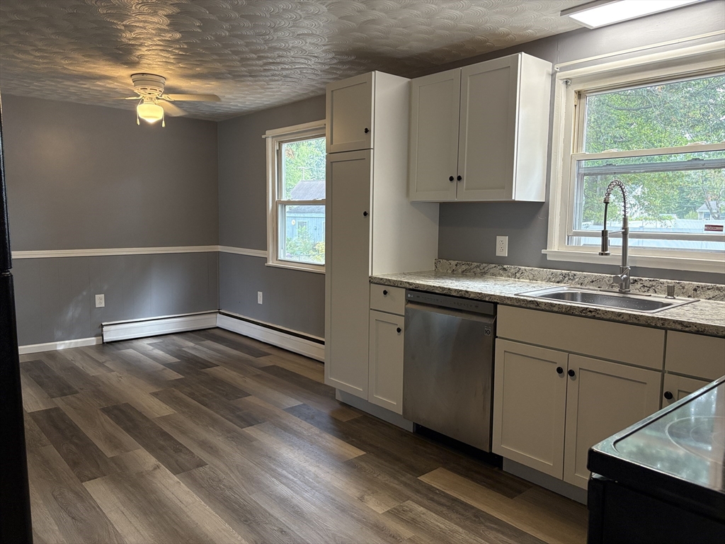 21 David Street Enfield, CT 06082 - Photo 3 of 21 a kitchen with a sink window and cabinets