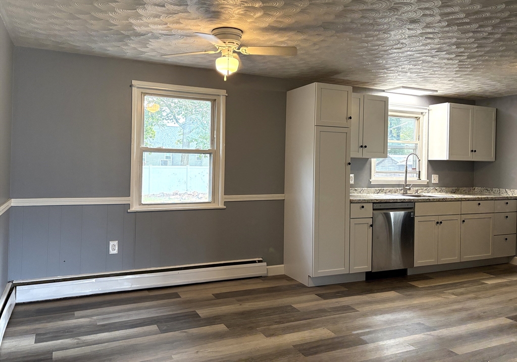 21 David Street Enfield, CT 06082 - Photo 5 of 21 a view of a kitchen with a sink wooden cabinets and a window