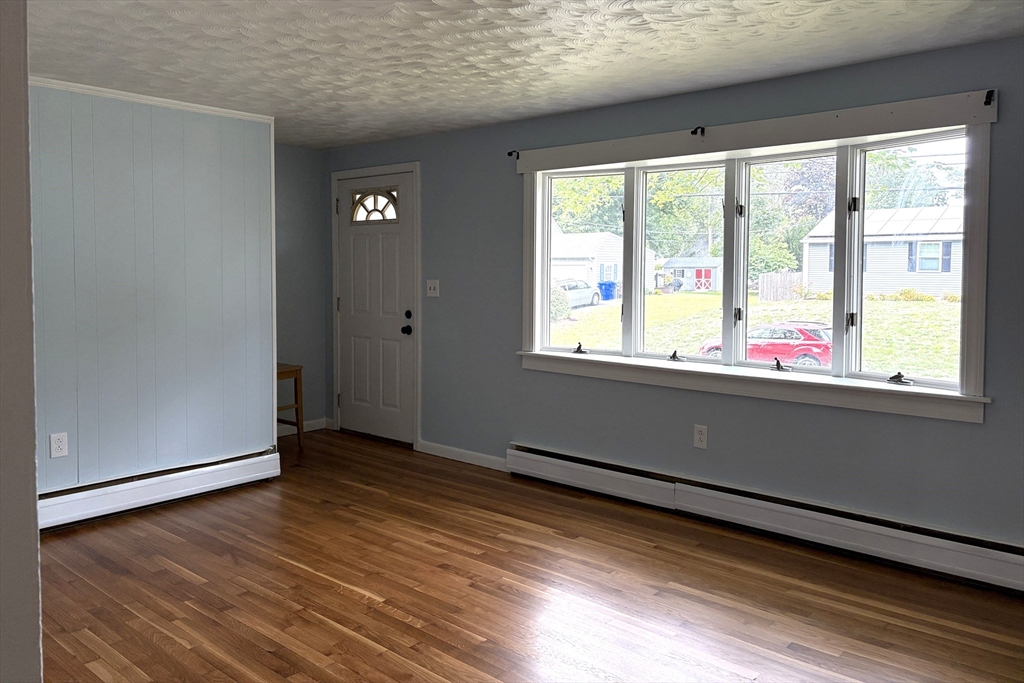 21 David Street Enfield, CT 06082 - Photo 8 of 21 a view of an empty room with wooden floor and a window